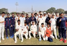 J&K cricket team posing with coaches after registering big win over Mizoram in Vijay Merchant Trophy match at Bhillai.