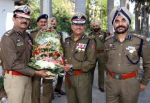 A police officer being felicitated on the occasion of Raising Day of Homeguards/Civil Defence in Jammu on Tuesday.