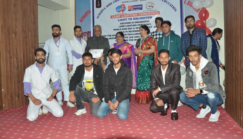 Winners of different games and competitions posing with guests at ASCONE Jammu.