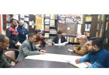 Former Minister and BJP vice president JK UT, Sham Lal Sharma listening to public grievances at party office Jammu on Thursday.