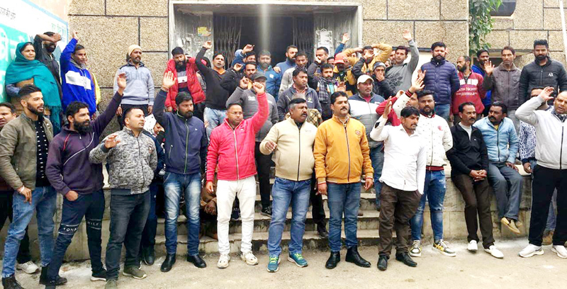 Safai Karamcharis protesting in front of Municipal Committee Udhampur on Friday. Safai Karamcharis protesting in front of Municipal Committee Udhampur on Friday.