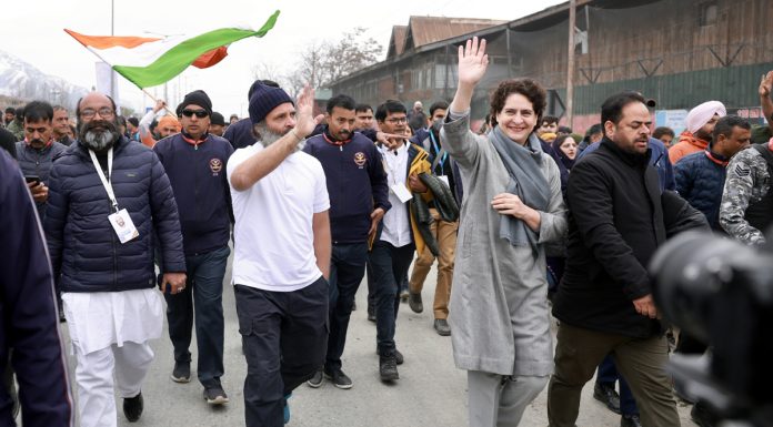 Rahul Gandhi and Priyanka wave at crowd as they lead Bharat Jodo Yatra in Kashmir on Saturday.