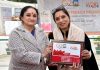 W20 Chair Dr Sandhya Purecha presenting a memento to Ritu Singh (founding chairperson of FICCI FLO JKL) during a program in Jammu.