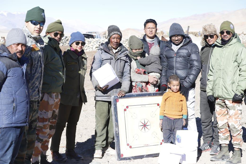 DC Leh Shrikant Suse posing with a nomadic family during visit to the area. DC Leh Shrikant Suse posing with a nomadic family during visit to the area.