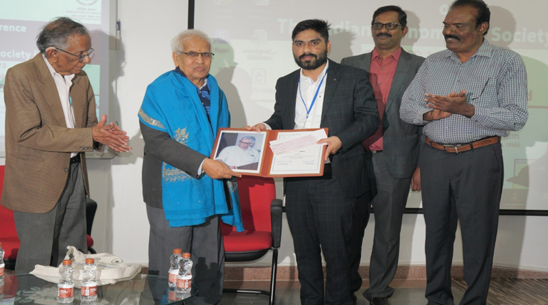 Dr Vaseem Akram of IIM Jammu being conferred with Prof MJ Manohar Rao Young Economist Award - 2022. Dr Vaseem Akram of IIM Jammu being conferred with Prof MJ Manohar Rao Young Economist Award - 2022.
