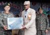 Northern Command chief Lt Gen Upendra Dwivedi honouring an ex-serviceman in Rajouri on Saturday.