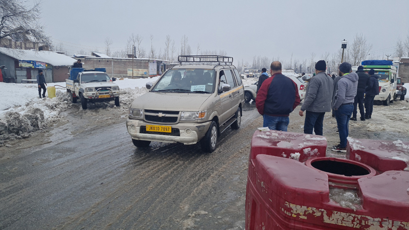 A vehicle moves in Anantnag after clearance of snow on Saturday. — Excelsior/Sajad Dar A vehicle moves in Anantnag after clearance of snow on Saturday. — Excelsior/Sajad Dar