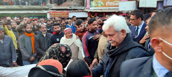 LG Manoj Sinha meeting locals at Dhangri in Rajouri on Monday. - Excelsior/Gafoor Bhat