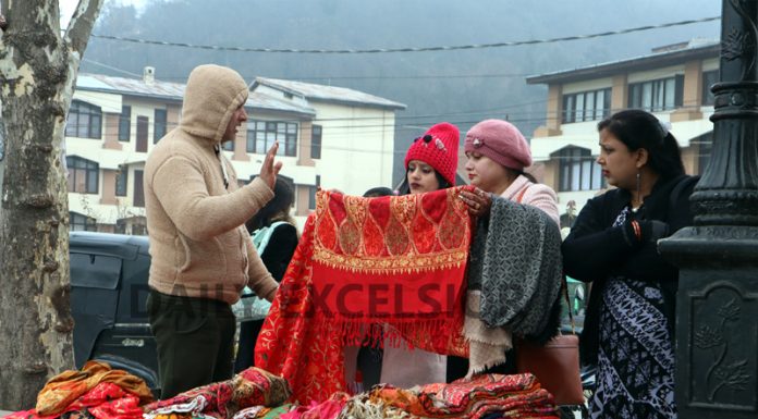 People purchase woolen clothes in Srinagar on Tuesday. -Excelsior/Shakeel
