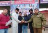 Man of the match player being awarded with trophy by dignataries at Kathua.