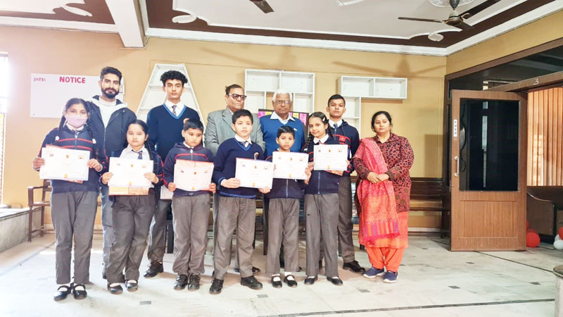 Students displaying certificates while posing with dignitaries at Jammu on Monday. Students displaying certificates while posing with dignitaries at Jammu on Monday.