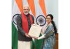 Prime Minister Narendra Modi presenting a souvenir to Hanaya Nasir at New Delhi on Tuesday.