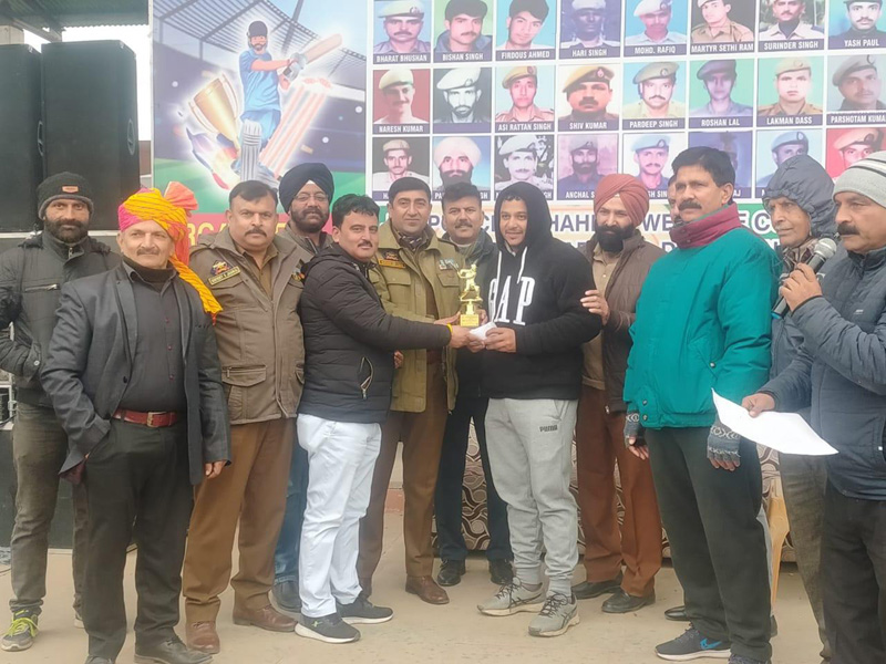 Press Club Kathua president Sanjay Pathak awarding man of the match to a player on Friday. Press Club Kathua president Sanjay Pathak awarding man of the match to a player on Friday.