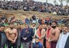 Wrestlers posing with dignitaries in Reasi on Monday.