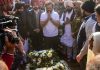 Congress leader Rahul Gandhi pays tribute to party leader Santokh Singh Chaudhary during the latter's funeral.