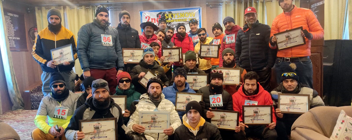 Winners displaying certificates while posing for a group photograph at Gulmarg on Monday. Winners displaying certificates while posing for a group photograph at Gulmarg on Monday.