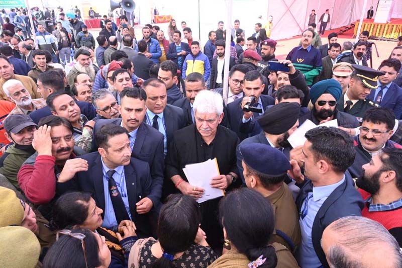LG Manoj Sinha with Kashmiri migrants at Jagti Colony in Jammu on Saturday. LG Manoj Sinha with Kashmiri migrants at Jagti Colony in Jammu on Saturday.