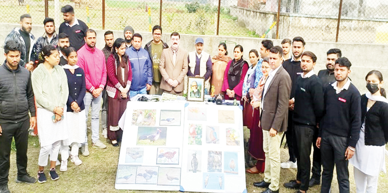 Students and staff members of GDC Marh posing with displayed exhibition in Jammu on Friday. Students and staff members of GDC Marh posing with displayed exhibition in Jammu on Friday.