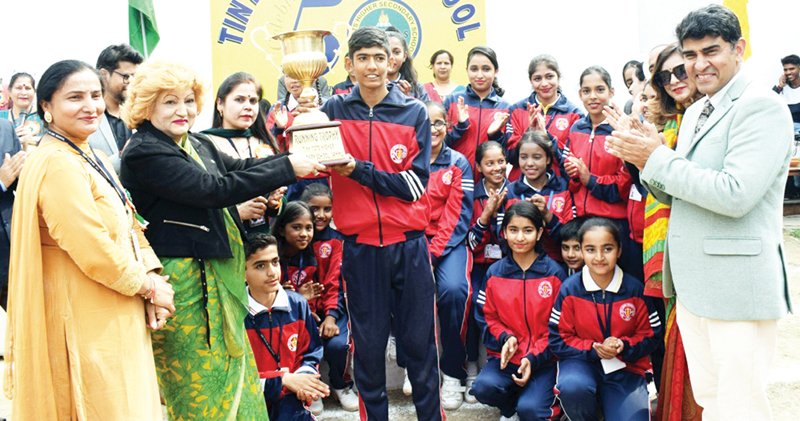 A trophy being presented to a winner during sports meet at Sainiki Colony, Jammu on Friday. A trophy being presented to a winner during sports meet at Sainiki Colony, Jammu on Friday.