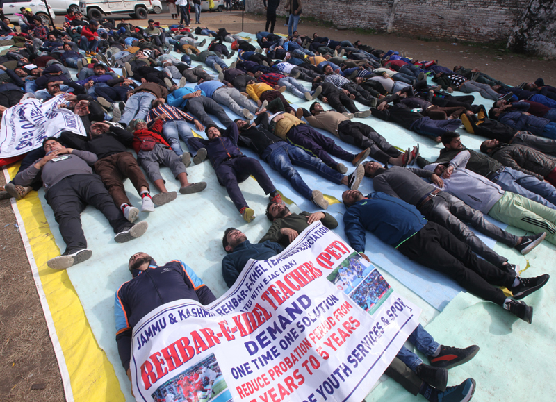 ReK teachers staging protest outside BJP headquarters at Trikuta Nagar on Friday. Excelsior/Rakesh ReK teachers staging protest outside BJP headquarters at Trikuta Nagar on Friday. Excelsior/Rakesh