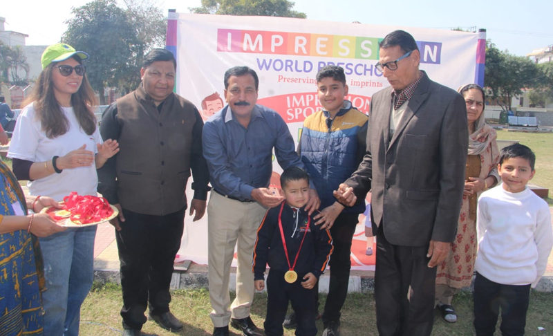 A toddler being awarded a medal by dignitaries at Sainik Colony on Saturday. A toddler being awarded a medal by dignitaries at Sainik Colony on Saturday.