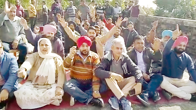Members of J&K Non Gazetted Electrical Employees Association raising slogans during a conference at Jammu on Saturday. Members of J&K Non Gazetted Electrical Employees Association raising slogans during a conference at Jammu on Saturday.