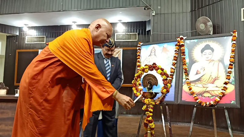 Bhikkhu Sanghasena lighting ceremonial lamp during seminar at JU on Wednesday. Bhikkhu Sanghasena lighting ceremonial lamp during seminar at JU on Wednesday.