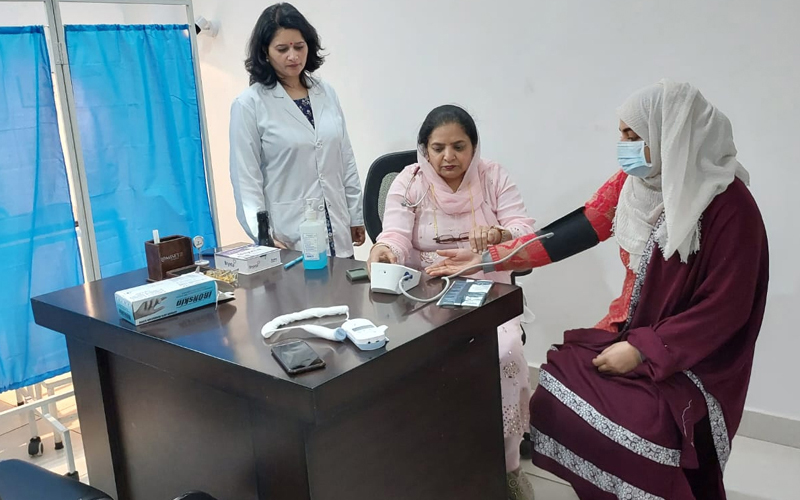 A doctor examining a patient during a Gynae checkup camp at Sure Diagnostics Specialized Lab in Jammu. A doctor examining a patient during a Gynae checkup camp at Sure Diagnostics Specialized Lab in Jammu.