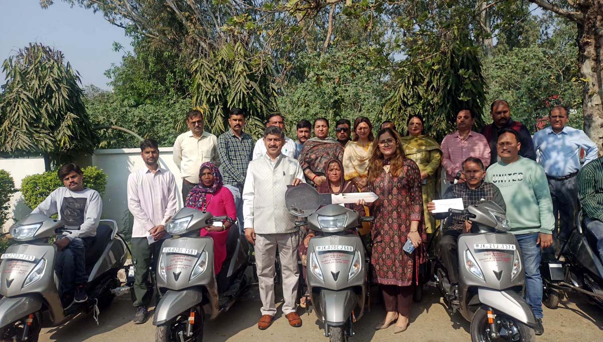 MP Jugal Kishore Sharma dedicates Motorized Tricycles Scooters to Physically Challenged persons in Gandhi Nagar. MP Jugal Kishore Sharma dedicates Motorized Tricycles Scooters to Physically Challenged persons in Gandhi Nagar.