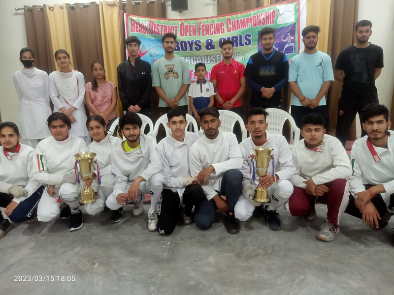 Winners displaying trophies while posing for a group photograph at Reasi on Wednesday. Winners displaying trophies while posing for a group photograph at Reasi on Wednesday.