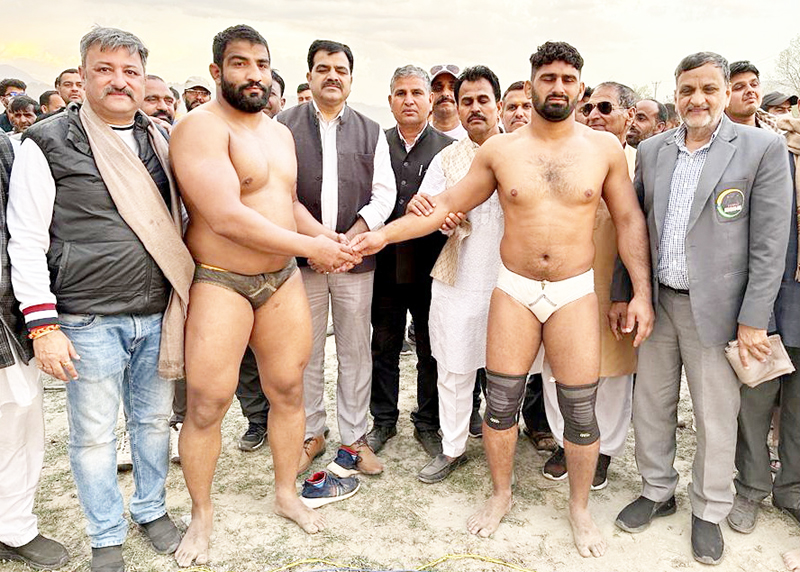 Wrestlers being introduced by dignitaries during Dangal in Akhnoor on Monday.
