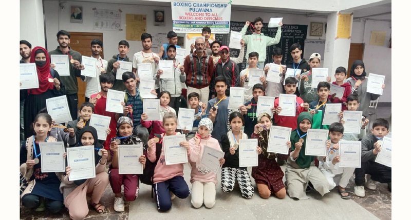 Winners displaying certificates at Pulwama on Sunday. Winners displaying certificates at Pulwama on Sunday.
