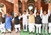 Opposition MPs form a Human chain during a protest out side the Parialment House over Adani row, in New Delhi on Thursday. (UNI)