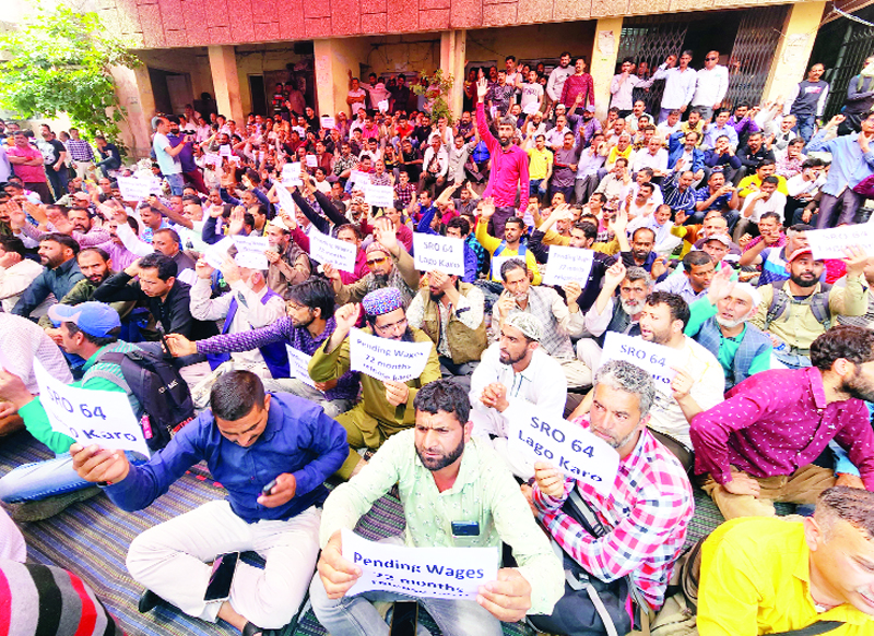 PHE workers staging protest dharna outside Chief Engg's office at BC Road in Jammu on Thursday. Excelsior/ Rakesh PHE workers staging protest dharna outside Chief Engg's office at BC Road in Jammu on Thursday. Excelsior/ Rakesh