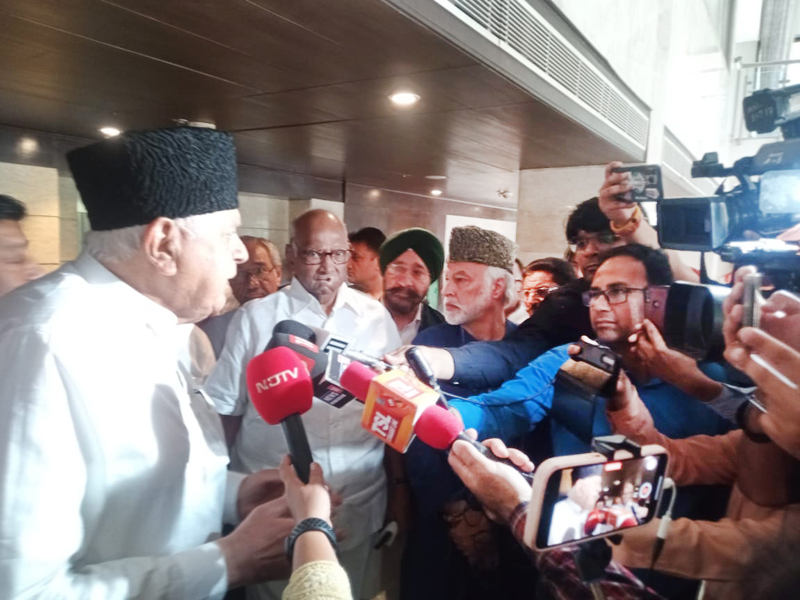 Sharad Pawar and Farooq Abdullah talking to mediapersons after meeting of all-party J&K delegation with opposition leaders at New Delhi on Thursday. Sharad Pawar and Farooq Abdullah talking to mediapersons after meeting of all-party J&K delegation with opposition leaders at New Delhi on Thursday.