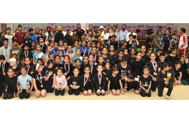 Winners displaying medals while posing for a group photograph along with diginitaries at MA Stadium Jammu on Monday. Winners displaying medals while posing for a group photograph along with diginitaries at MA Stadium Jammu on Monday.