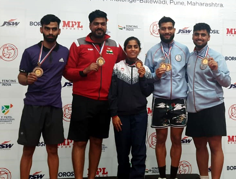J&K fencing players displaying their medals. J&K fencing players displaying their medals.