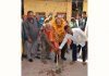 Councillor Sham Lal Basson starting lane and drain work in Ward 48 on Wednesday.