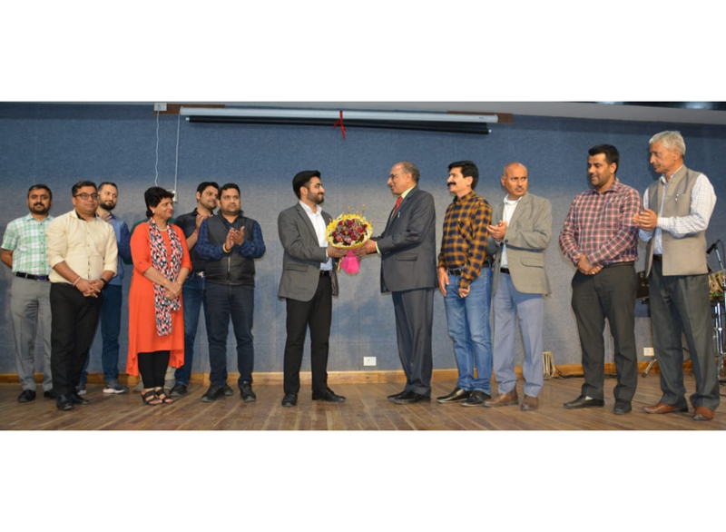 Director Information giving bouquet to Jawahir Lal Raina on his superannuation. Director Information giving bouquet to Jawahir Lal Raina on his superannuation.