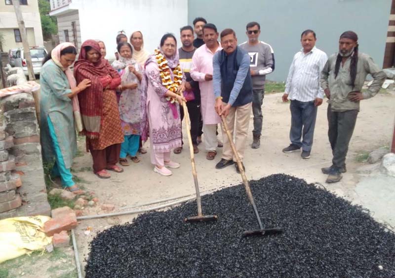 JMC Corporator Rajni Bala initiating blacktopping work of lanes at Mohallah Dhok in Jammu North Assembly segment. JMC Corporator Rajni Bala initiating blacktopping work of lanes at Mohallah Dhok in Jammu North Assembly segment.