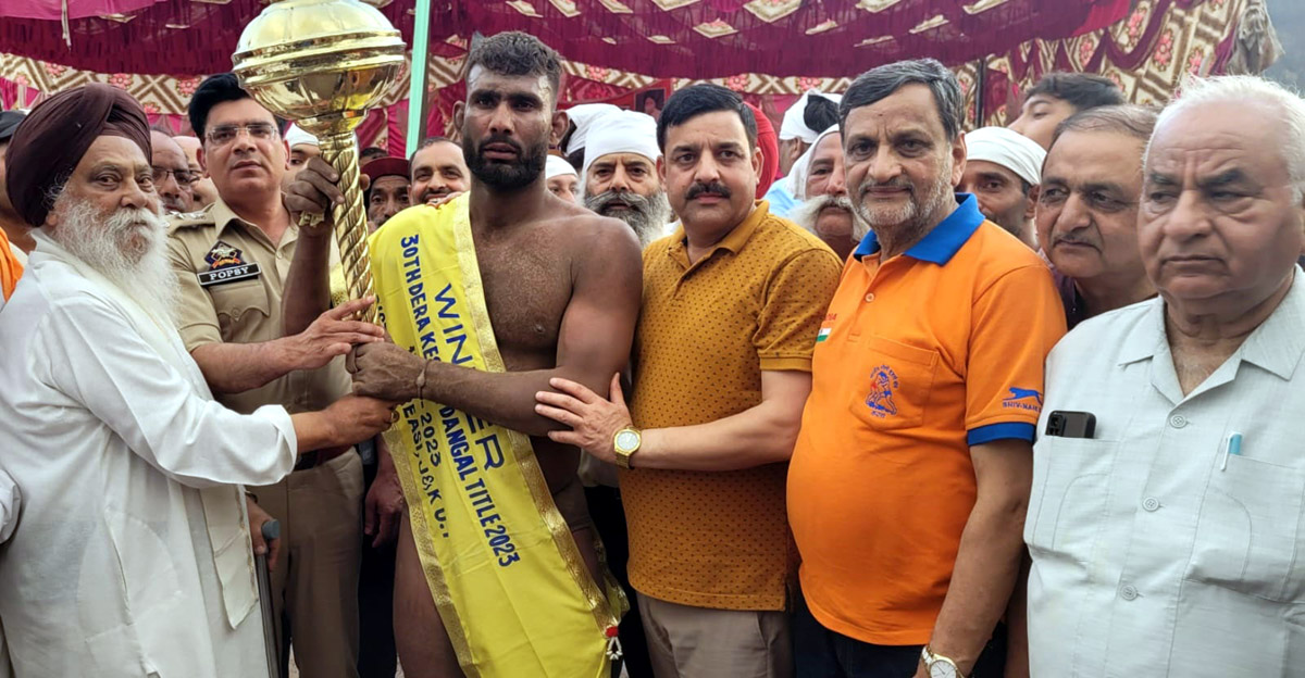 A winner being awarded with traditional Gadda (Gurj) by dignitaries at Reasi on Friday. A winner being awarded with traditional Gadda (Gurj) by dignitaries at Reasi on Friday.