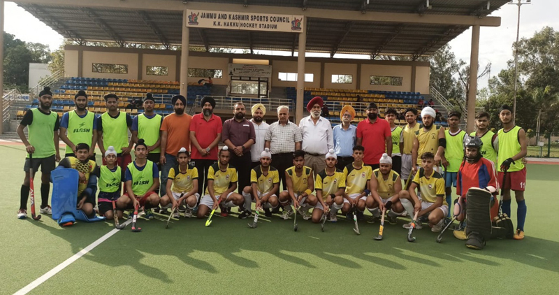 Players posing with Divisional Sports Officer Ashok Singh and others at KK Hakku Stadium Jammu on Wednesday. Players posing with Divisional Sports Officer Ashok Singh and others at KK Hakku Stadium Jammu on Wednesday.