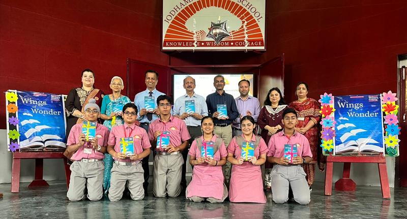 Students and dignitaries displaying the book 'Wings of Wonder' at Jodhamal on Saturday. Students and dignitaries displaying the book 'Wings of Wonder' at Jodhamal on Saturday.