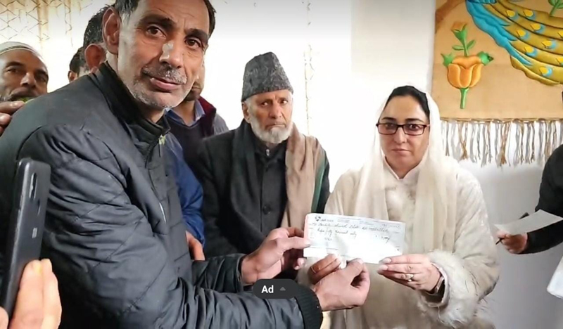 Waqf Board Chairperson, Dr Darakhshan Andrabi providing relief cheque to a Hazratbal fire victim on Wednesday. Waqf Board Chairperson, Dr Darakhshan Andrabi providing relief cheque to a Hazratbal fire victim on Wednesday.