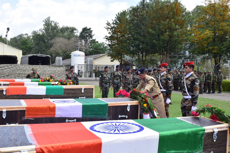 Army officers paying tribute to bravehearts in Rajouri on Friday. Army officers paying tribute to bravehearts in Rajouri on Friday.