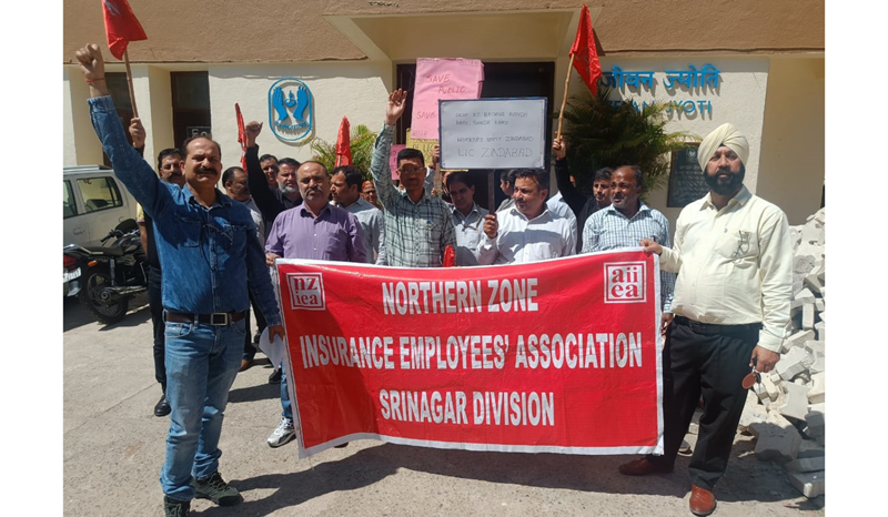 LIC employees staging a demonstration in Srinagar on Wednesday. LIC employees staging a demonstration in Srinagar on Wednesday.