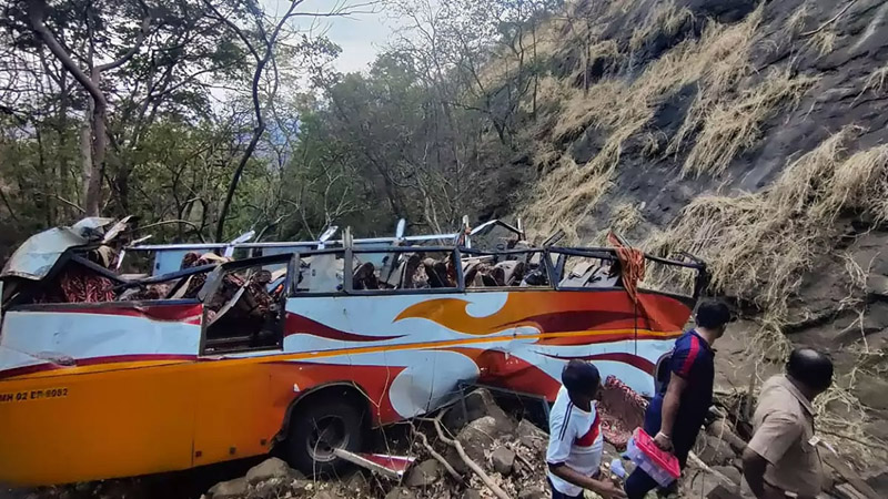 Wrecked remains of a bus that fell into a gorge leaving at least 12 persons dead and 27 others injured on Mumbai-Pune highway, in Raigad district.