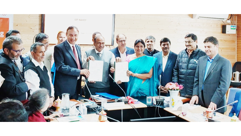 SKUAST-Jammu VC & TNAU VC displaying copies of MoU signed between the two universities on Friday.