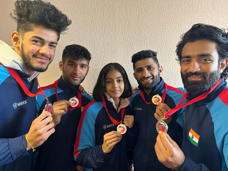 J&K Wushu players displaying Gold medals while posing for a group photograph at Moscow. J&K Wushu players displaying Gold medals while posing for a group photograph at Moscow.