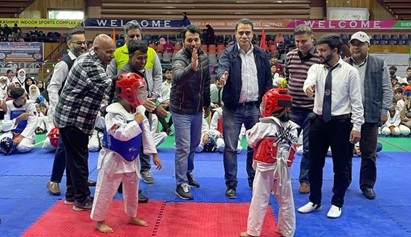 Little Taekwondo players in action during a bout at Sher-e-Kashmir Indoor Sports Complex, Srinagar. Little Taekwondo players in action during a bout at Sher-e-Kashmir Indoor Sports Complex, Srinagar.